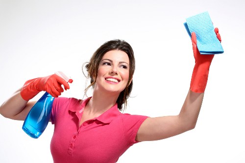 Cleaning team maintaining shared office areas and workstations